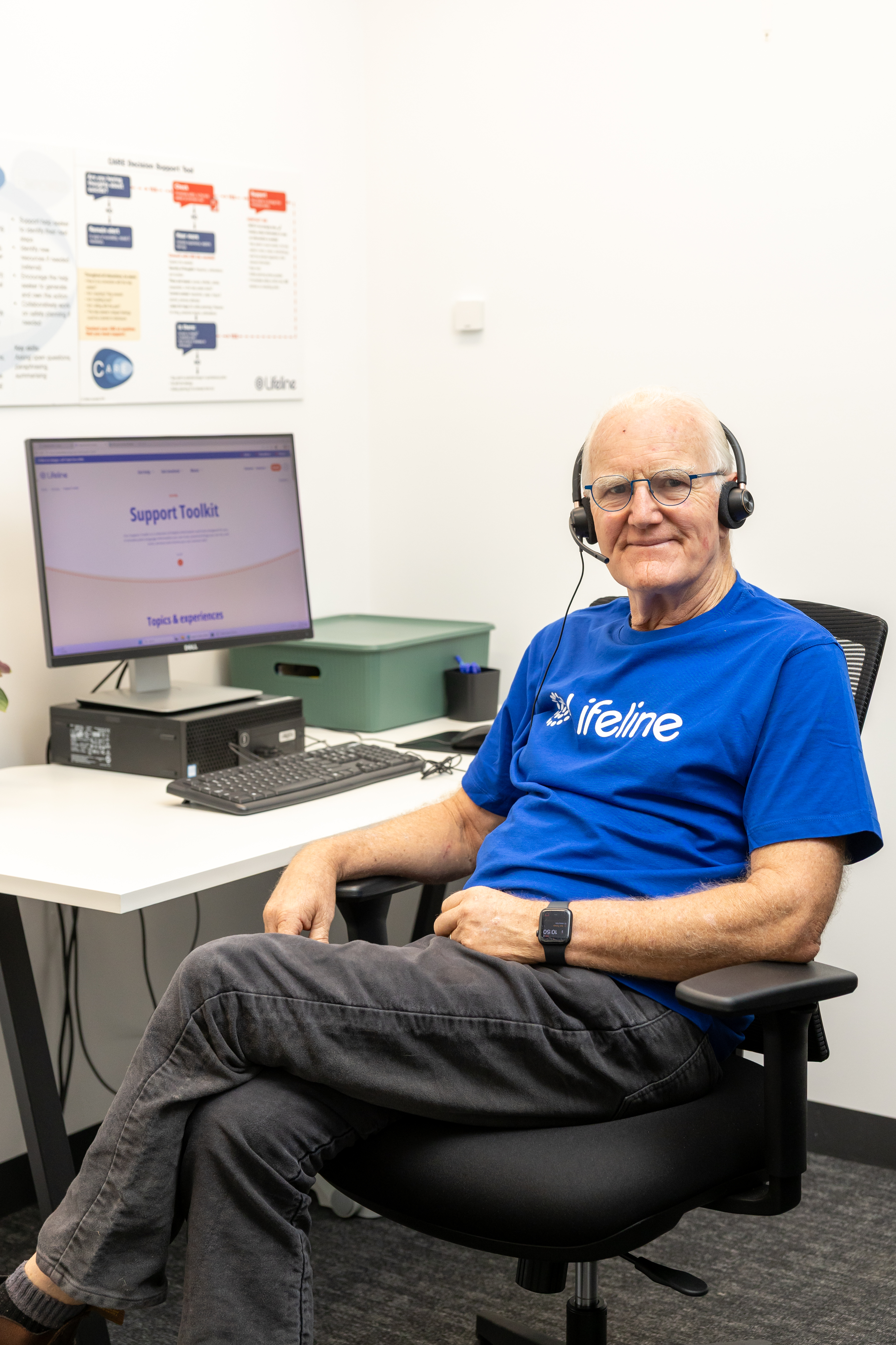 Lifeline crisis supporter in headset looking at camera