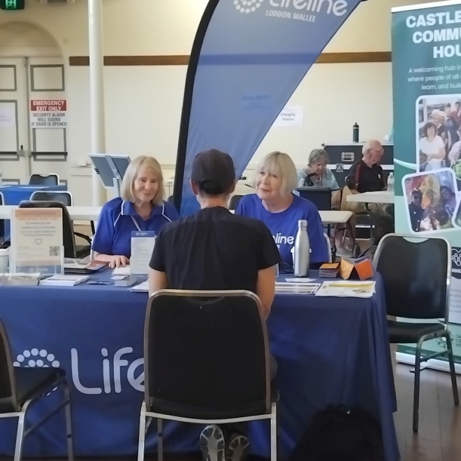 Two Lifeline crisis support volunteers speaking to a person