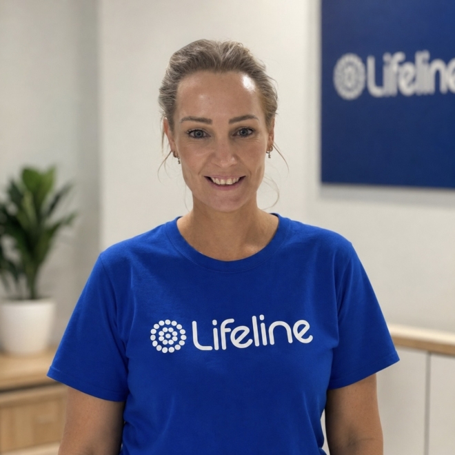 Woman in Lifeline t-shirt looking at camera