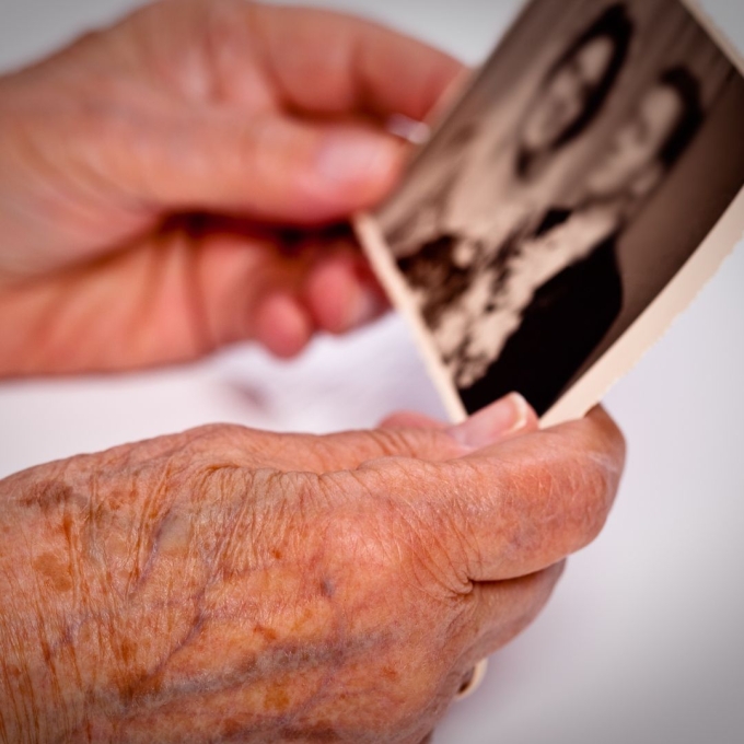 Woman holding wedding photo