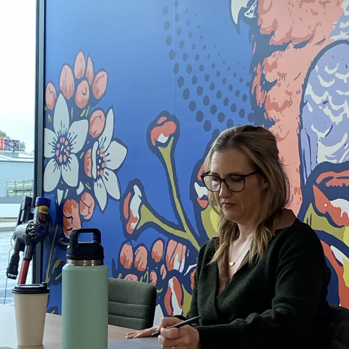 Woman taking notes during training session