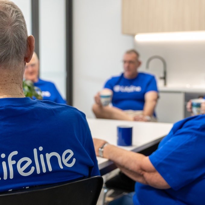 Lifeline crisis supporters sitting in gorup with back to camera