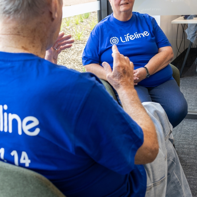 Two Lifeline crisis support volunteers speaking to each other