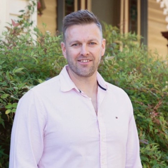 Man standing outside looking at camera