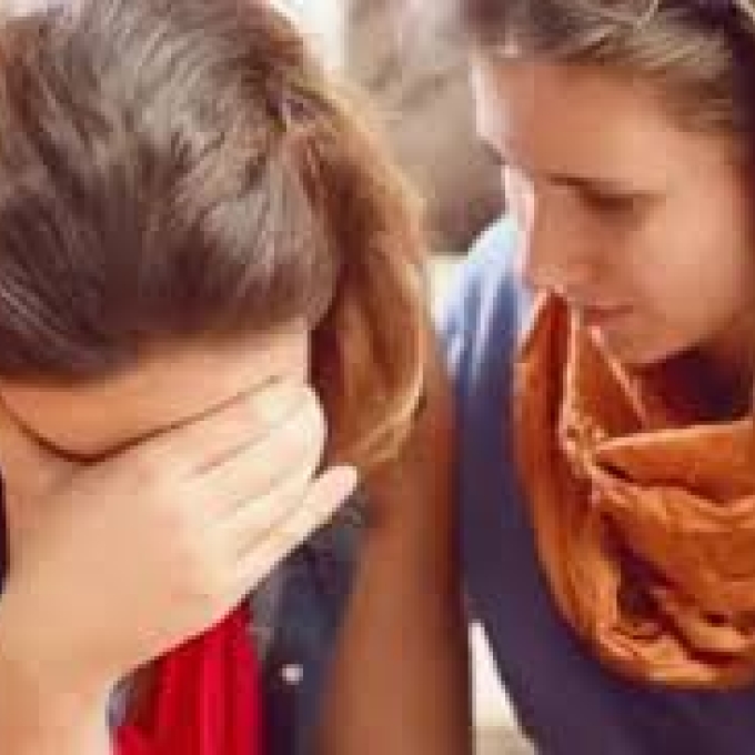 Woman comforting another woman